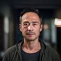 用户老王的头像，中年男性正面照，背景为模糊的室内环境
